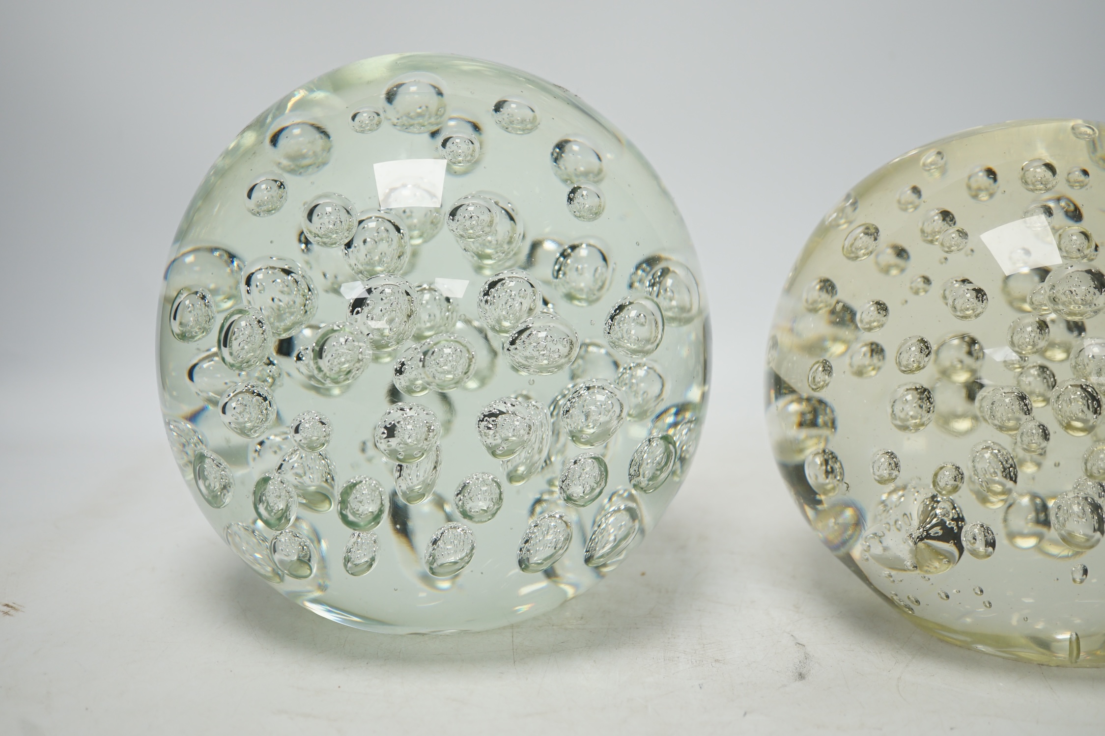 Two large glass bubble included door stops, 18cm. Condition - fair